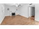 Bright living room featuring wood-look tile floors and a classic brick fireplace at 3215 W Villa Rosa St, Tampa, FL 33611