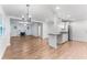Open-concept living space with a view of the kitchen and fireplace at 3215 W Villa Rosa St, Tampa, FL 33611