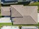 Aerial view highlighting the roof, landscaping, and overall property layout at 3326 Acacia Bay Ave, Wesley Chapel, FL 33543