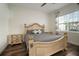 Bright bedroom with large window, ceiling fan, and decorative furnishings; creating a serene and comfortable retreat at 3326 Acacia Bay Ave, Wesley Chapel, FL 33543
