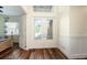 The home's bright foyer features wood flooring and a glass-paneled door at 3326 Acacia Bay Ave, Wesley Chapel, FL 33543