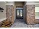 A stone-accented entrance features a double door and lovely stonework at 3326 Acacia Bay Ave, Wesley Chapel, FL 33543