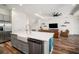 Open kitchen with island, stainless steel appliances, and easy access to the living area at 3326 Acacia Bay Ave, Wesley Chapel, FL 33543