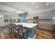 Updated kitchen features an island, stylish cabinets, modern appliances, and a dining nook at 3326 Acacia Bay Ave, Wesley Chapel, FL 33543