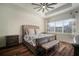 Comfortable main bedroom with a ceiling fan and a beautiful patterned bedspread at 3326 Acacia Bay Ave, Wesley Chapel, FL 33543