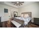 Spacious main bedroom with ceiling fan and a beautiful patterned bedspread at 3326 Acacia Bay Ave, Wesley Chapel, FL 33543