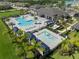 A sprawling community pool area with a splash pad, and plenty of lounge seating at 3326 Acacia Bay Ave, Wesley Chapel, FL 33543