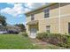Back exterior view featuring a sliding glass door, lawn, and blue skies at 3406 Dragon View Ct, Valrico, FL 33594