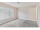Spacious bedroom with carpet flooring and large window, offering plenty of light at 3406 Dragon View Ct, Valrico, FL 33594
