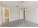 Carpeted bedroom with two doorways, one leading to an adjoining bathroom at 3406 Dragon View Ct, Valrico, FL 33594