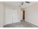 Bedroom with carpet, closet, ceiling fan and view into the Primary bathroom at 3406 Dragon View Ct, Valrico, FL 33594