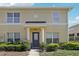 Inviting two-story home with a covered entryway, lush landscaping, and a charming architectural design at 3406 Dragon View Ct, Valrico, FL 33594