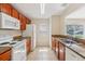Functional kitchen with ample cabinet space, granite countertops, and essential appliances for everyday cooking at 3406 Dragon View Ct, Valrico, FL 33594