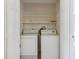 Laundry closet with washer and dryer hookups and wire shelving at 3406 Dragon View Ct, Valrico, FL 33594