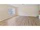 Bright living room with wood flooring and large windows for natural light at 3406 Dragon View Ct, Valrico, FL 33594