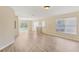 Spacious living area with sliding glass doors, wood floors, and natural light for a comfortable atmosphere at 3406 Dragon View Ct, Valrico, FL 33594