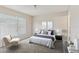 Serene main bedroom features large window, neutral decor, and plush carpeting for a relaxing retreat at 3406 Dragon View Ct, Valrico, FL 33594