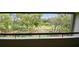 Balcony view overlooking lush greenery and mature trees, a peaceful setting at 36750 Us 19 N # 20311, Palm Harbor, FL 34684