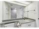 Washroom featuring tile flooring, a shower, and granite countertops at 36750 Us 19 N # 20311, Palm Harbor, FL 34684
