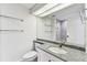 Washroom featuring tile flooring, a shower, and granite countertops at 36750 Us 19 N # 20311, Palm Harbor, FL 34684