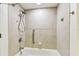 Well-maintained bathroom featuring a shower, grab bar, and neutral tile at 36750 Us 19 N # 20311, Palm Harbor, FL 34684
