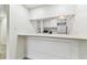 Efficient kitchen features a breakfast bar, connecting to the living area with modern convenience at 36750 Us 19 N # 20311, Palm Harbor, FL 34684