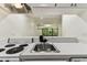 Efficient kitchen features a breakfast bar, enhancing connectivity with the living area and natural light at 36750 Us 19 N # 20311, Palm Harbor, FL 34684