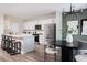 Modern kitchen featuring an island, stainless steel appliances, and ample cabinet space, perfect for culinary enthusiasts and entertaining guests at 37225 Sagemoor Dr, Zephyrhills, FL 33541