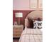 Chic primary bedroom with a stylish bed, plush pillows, and neutral tones creating a serene retreat for rest and relaxation at 37225 Sagemoor Dr, Zephyrhills, FL 33541