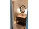 Modern bathroom features granite countertops, tiled shower, and modern fixtures for a sleek and functional space at 401 Pennsylvania Ave, Crystal Beach, FL 34681