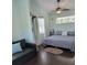 Bright bedroom featuring a comfortable bed, sofa chair, and fresh decor at 401 Pennsylvania Ave, Crystal Beach, FL 34681