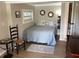 This bedroom is decorated with a blue comforter and a 