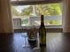 Bright dining area with views offers wine storage and natural light, perfect for entertaining and relaxation at 401 Pennsylvania Ave, Crystal Beach, FL 34681