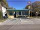 Charming Crystal Beach building with teal trim and easy access parking, including designated handicapped spots at 401 Pennsylvania Ave, Crystal Beach, FL 34681