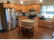 Modern kitchen features stainless steel appliances, custom cabinets, and an island for meal preparation at 401 Pennsylvania Ave, Crystal Beach, FL 34681