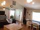 Inviting living room featuring tile floors, front door access, and a stylish decor for comfortable living at 401 Pennsylvania Ave, Crystal Beach, FL 34681