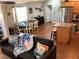 Cozy living room and kitchen combination with hardwood floors and stainless steel appliances at 401 Pennsylvania Ave, Crystal Beach, FL 34681
