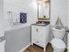 Stylish bathroom with shiplap walls, modern vanity, and decorative nautical accents at 4202 Harbor House Dr # 24, Tampa, FL 33615