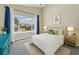 Bright bedroom showcasing a large window, neutral walls, and coordinated decor at 4202 Harbor House Dr # 24, Tampa, FL 33615