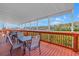 View of the covered deck including table and chairs overlooking the water at 4202 Harbor House Dr # 24, Tampa, FL 33615