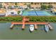 Community dock featuring tennis courts and boat slips at 4202 Harbor House Dr # 24, Tampa, FL 33615