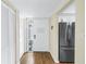 Inviting entryway featuring a white door with glass panel and hardwood flooring at 4202 Harbor House Dr # 24, Tampa, FL 33615