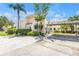 Charming condo exterior with well-kept landscaping and covered parking at 4202 Harbor House Dr # 24, Tampa, FL 33615