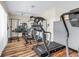 Community fitness center showcasing a variety of exercise equipment on laminate flooring for residents' convenience at 4202 Harbor House Dr # 24, Tampa, FL 33615