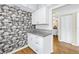 Bright kitchen with white cabinetry, granite countertops, and modern hardware at 4202 Harbor House Dr # 24, Tampa, FL 33615