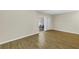 Bright living room featuring wood-look floors and sliding door to dining area at 4202 Harbor House Dr # 24, Tampa, FL 33615