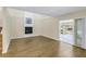 Bright living room with wood-look floors and sliding glass door to patio at 4202 Harbor House Dr # 24, Tampa, FL 33615