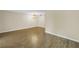 Spacious living room with wood-look floors and chandelier at 4202 Harbor House Dr # 24, Tampa, FL 33615