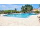 Large, inviting community pool surrounded by a spacious, decorative tile deck at 4202 Harbor House Dr # 24, Tampa, FL 33615