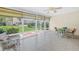 Bright sunroom with tile flooring, large windows, and relaxing wicker furniture at 4202 Harbor House Dr # 24, Tampa, FL 33615